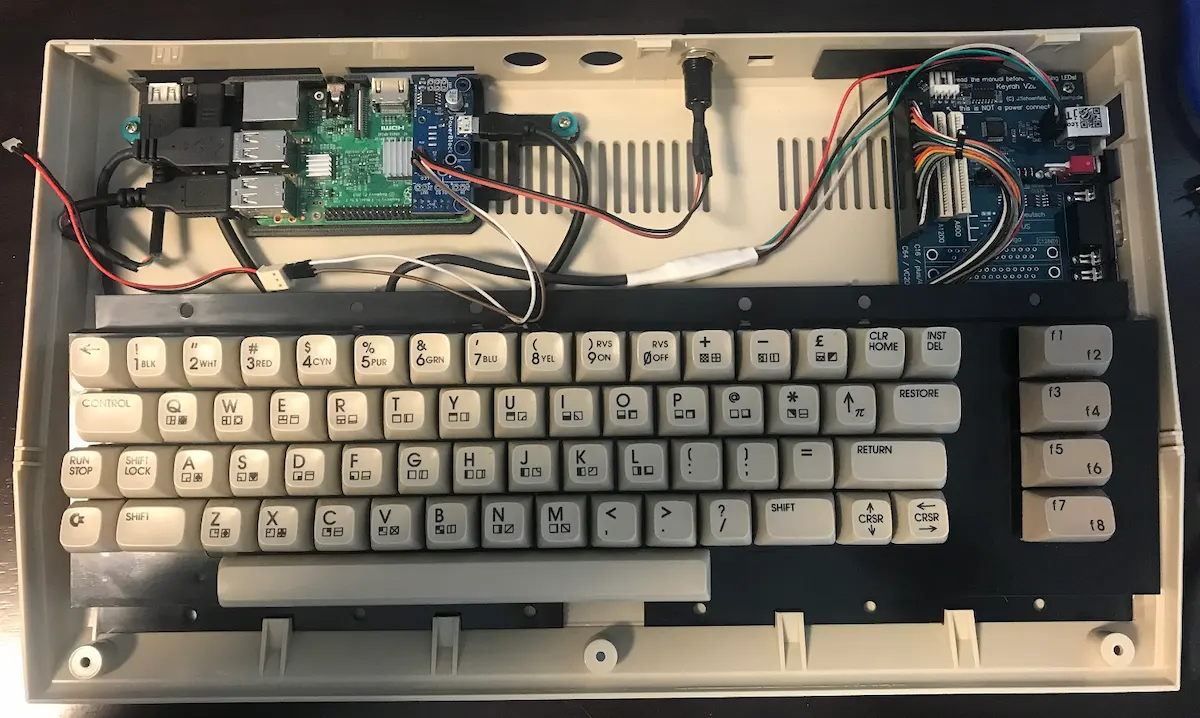 Keyrah V2b interface board and Raspberry Pi installed inside an original Commodore 64C case, the basis of the Raspberry Pi C64 mod
