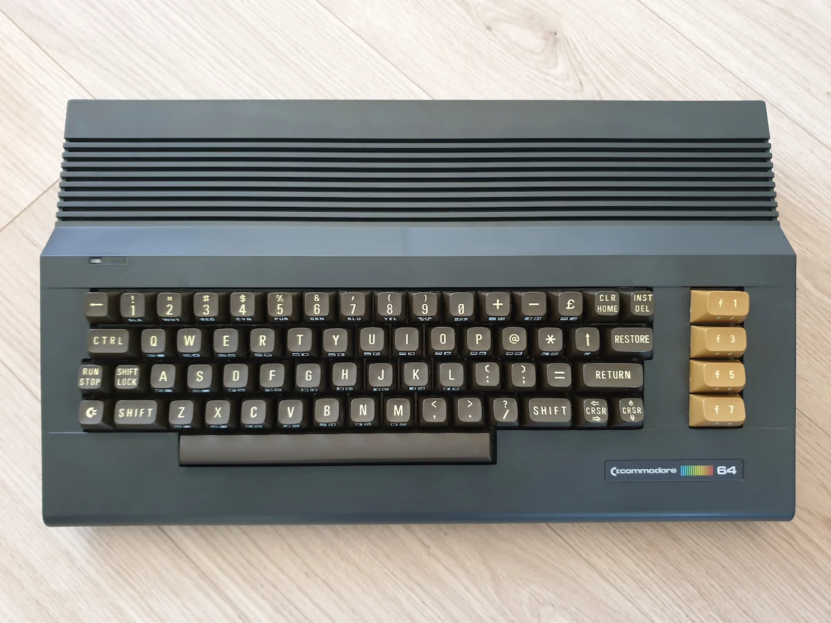 Black Commodore 64C, straight front view showing the black housing