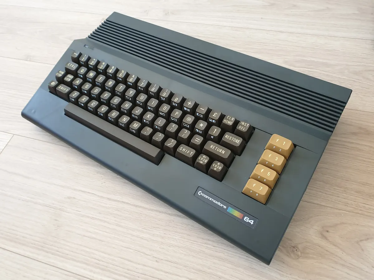 Black Commodore 64C with Breadbin keyboard, angled view