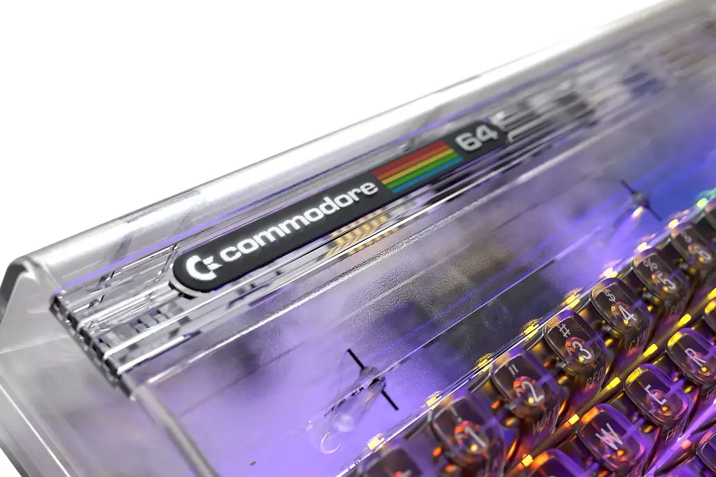 Commodore 64 Ultimate Starlight Edition transparent case with 70 RGB LEDs illuminating the keyboard