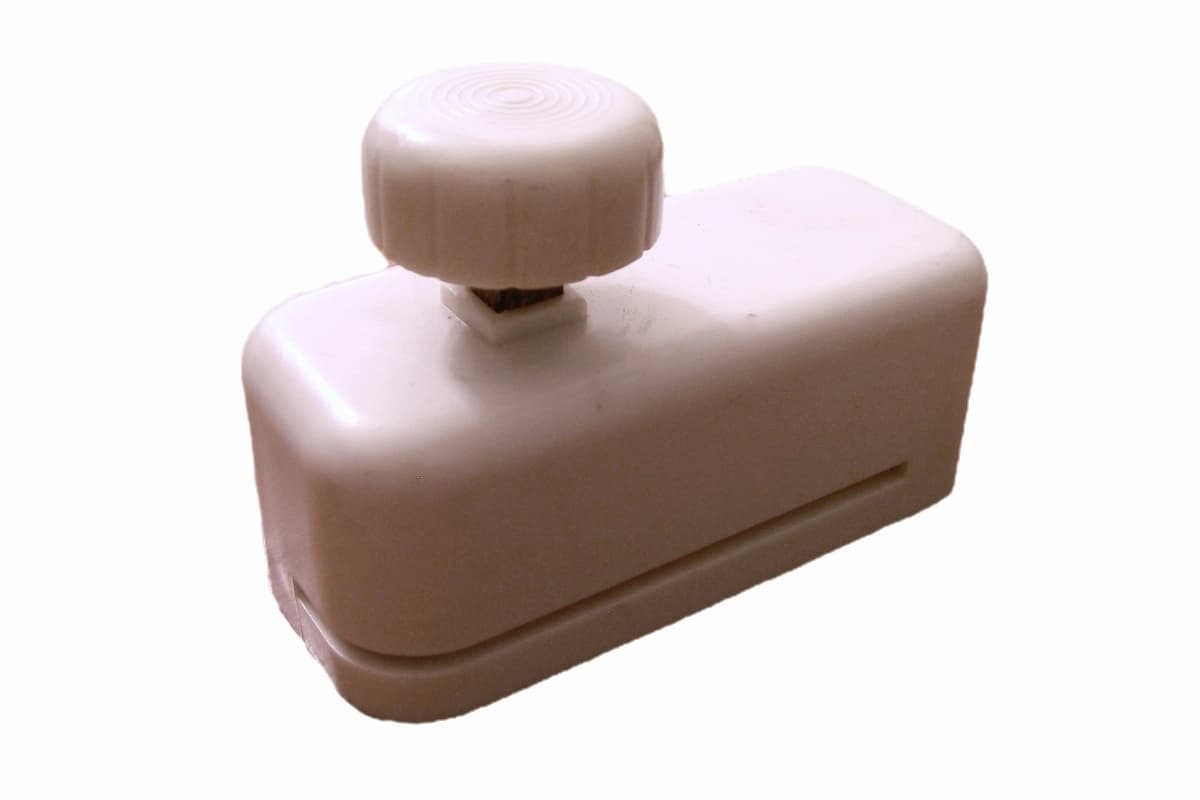 Floppy disk notching tool used to make 5.25-inch disks double-sided for the Commodore 1541